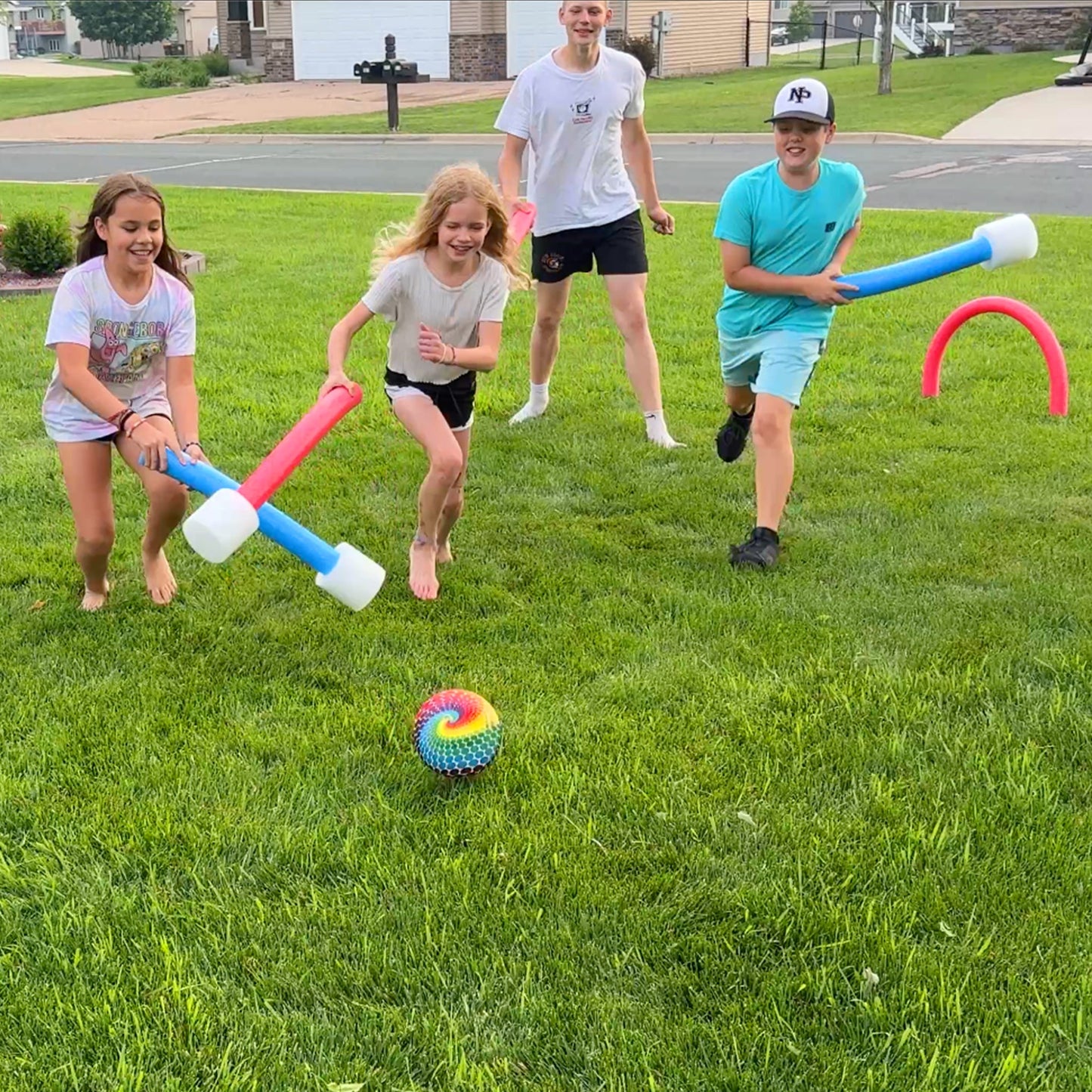 Oodles of Noodles Foam Giggle Ball Game with Noodle Hoops and Mallets for Outdoor Fun